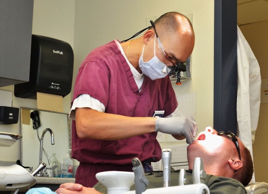 Dentist examining a patient's teeth in a clinic
