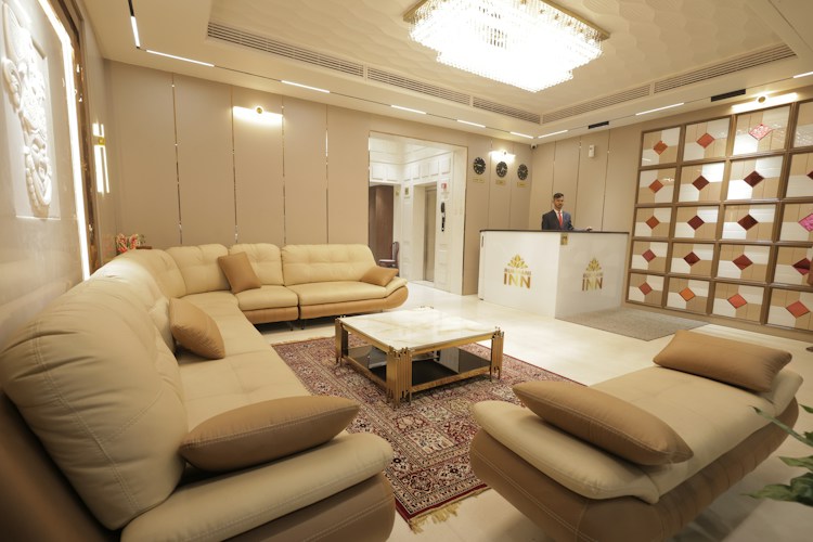 Modern hotel lobby with reception desk and seating area