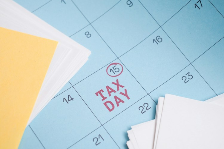 Calendar marked with "tax day" on the 15th